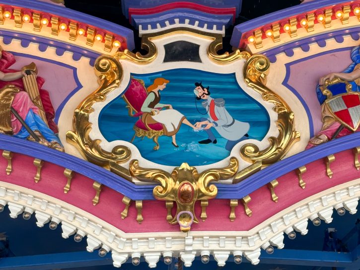 Depiction of Cinderella putting on the glass slipper at the top ofPrince Charming's Carrousel.