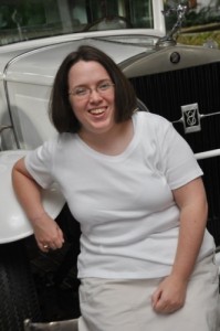 Olivia-in-front-of-antique-car