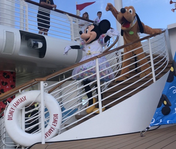 Minnie and Pluto get ready to surprise Mickey