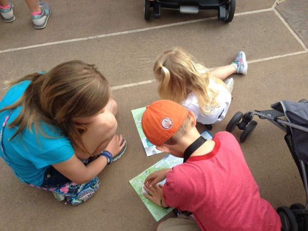 Kids plan day using maps from Walt Disney World 