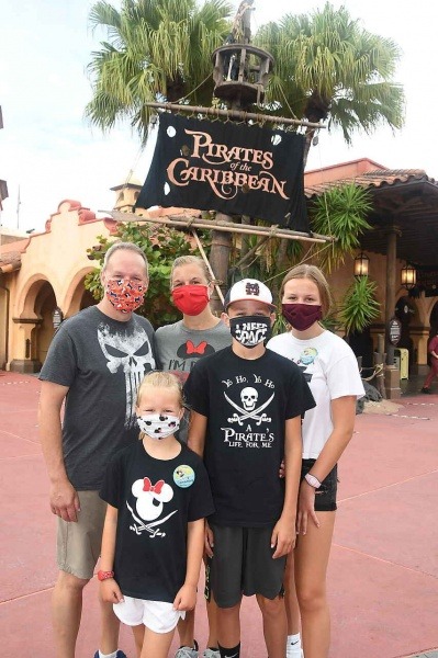 Add masks to your Disney packing list Family Wearing Masks in Magic Kingdom | Five Things to Add to Your Disney Packing List