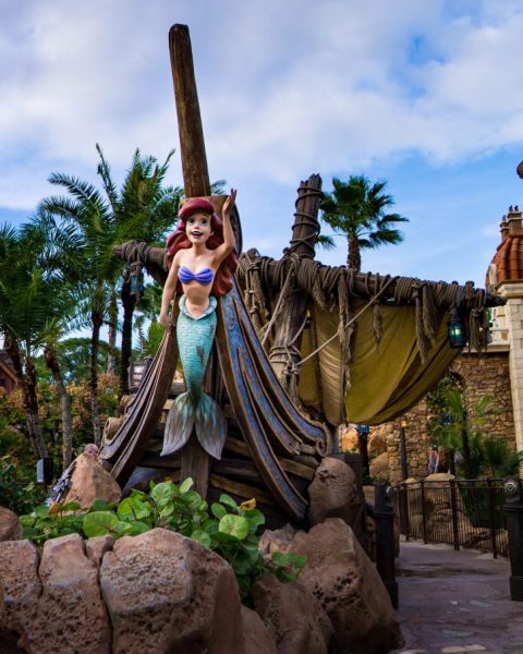 Image of a wood carving of Ariel attached to the front of a boat.