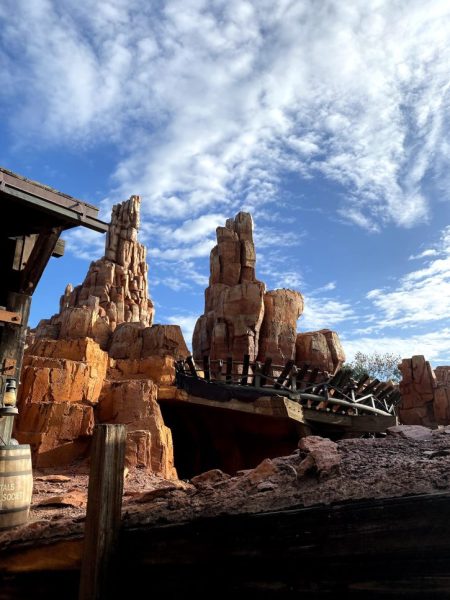 A view from the bottom of Big Thunder Mountain looking up at the mountain with some of the track covering the peak. 