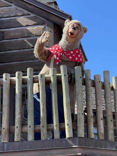 One of the stars of the Country Bear Jamboree stands outside the attraction.