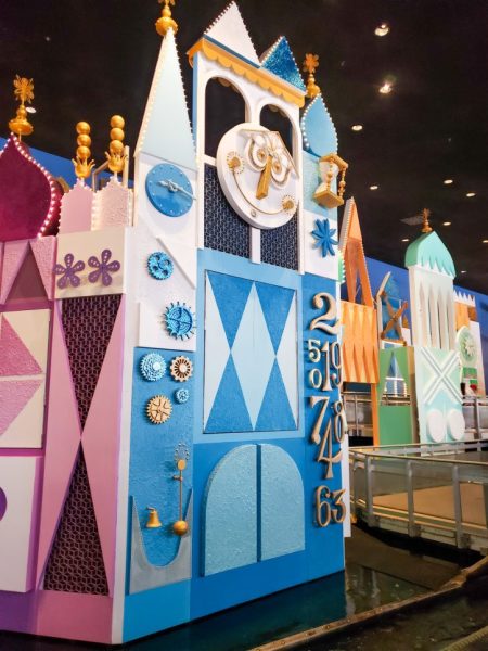 Image from inside small world. The giant multicolored clock that is viewable in the queue.