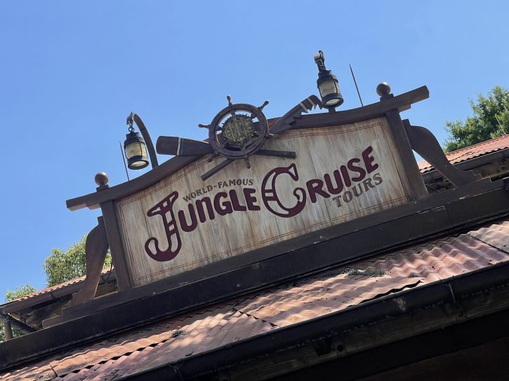 Sign outside the queue for the Jungle Cruise. Sign appears to be made out of material from a shipwreck.