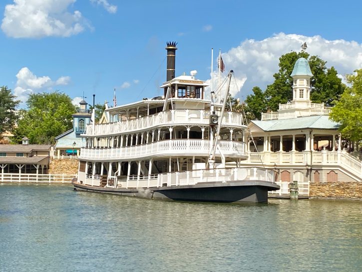 Image of the Liberty Square Riverboat at the port where guests can get on. The Riverboat is designed to look like the old Steamboats that would travel the Mississippi River.