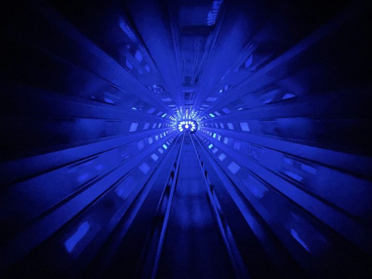 A tunnel with blue flashing lights in Space Mountain.