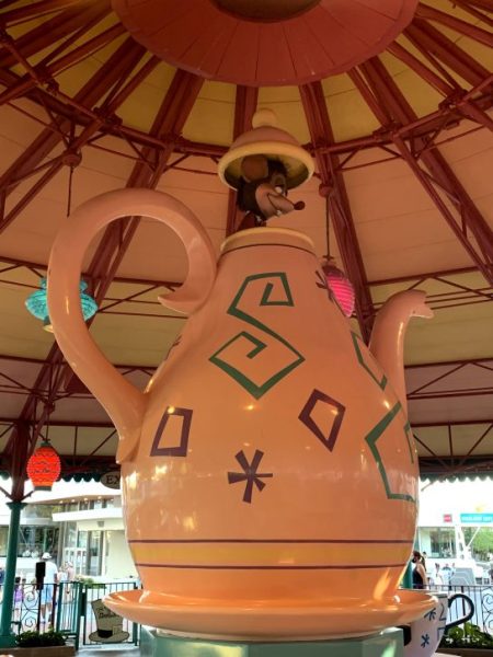 The giant Tea Kettle at the center of the Magic Tea Party which has a mouse poking out from the lid. 