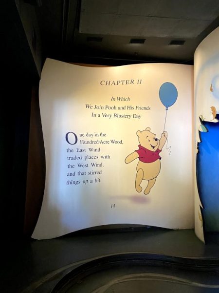 An image of a page out of a giant Winnie the Pooh Book that guests ride through on the ride. 