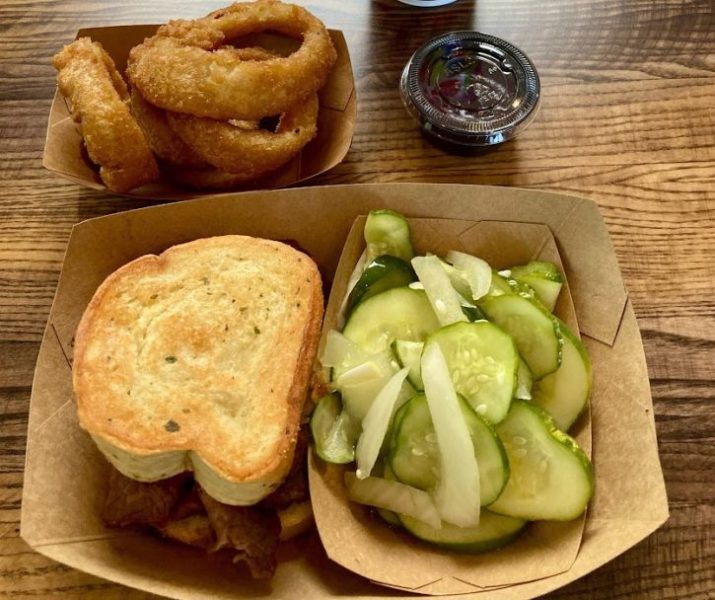 Regal Eagle Sandwich, cucumbers, and onion rings. Epcot
